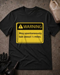 Black drag racing T-shirt featuring a yellow and black warning sign with an exclamation icon and “Warning: May spontaneously talk about ¼ miles.”