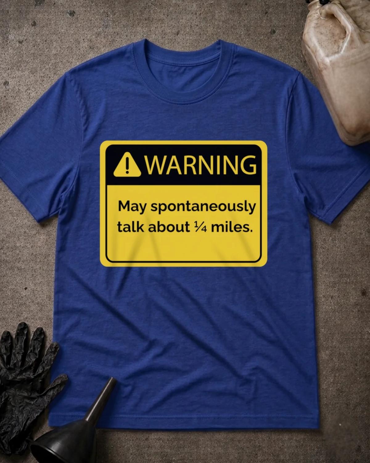True Royal blue drag racing T-shirt featuring a yellow and black warning sign with an exclamation icon and “Warning: May spontaneously talk about ¼ miles.”