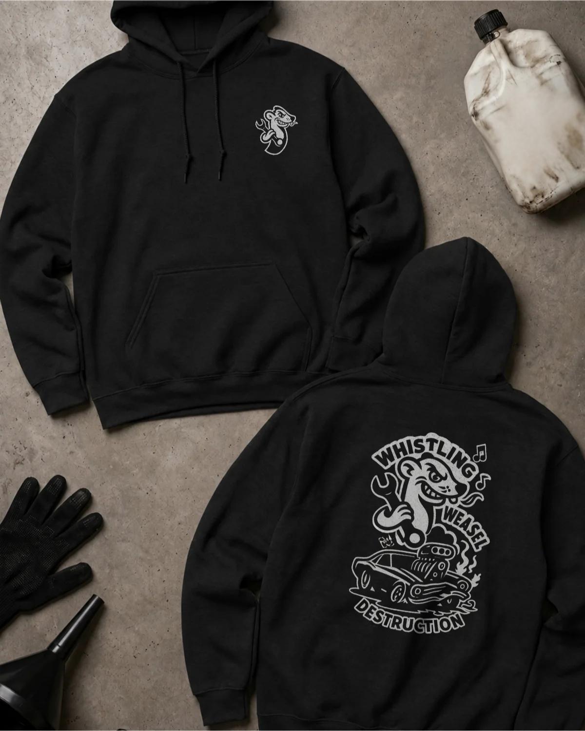 Black Whistling Weasel Destruction hoodie, front and back views with a small weasel chest logo and large white back graphic of a weasel holding a wrench above a supercharged car, with musical notes and “Whistling Weasel Destruction.”