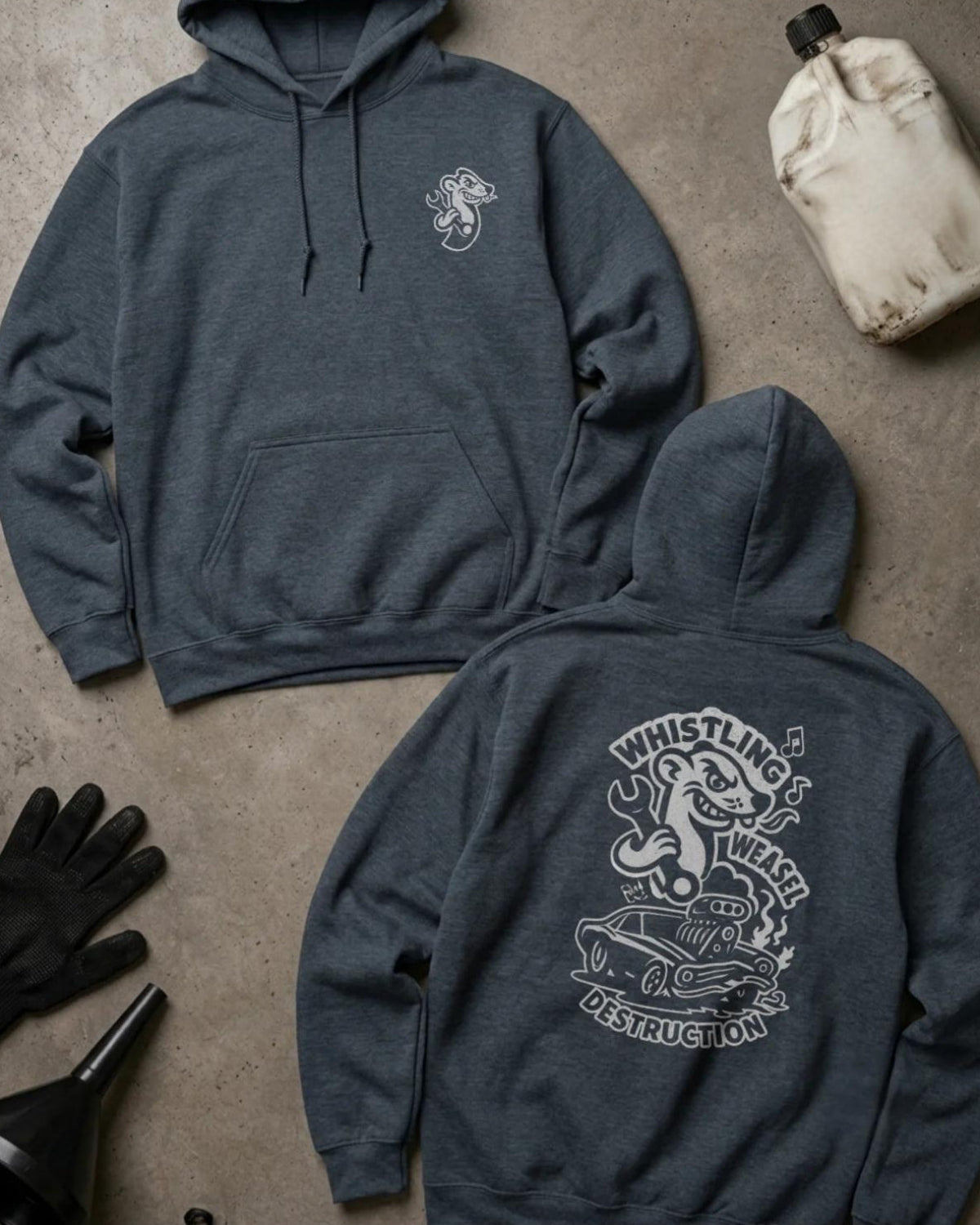 Dark Heather gray Whistling Weasel Destruction hoodie, front and back views with a small weasel chest logo and white back graphic of a weasel holding a wrench above a supercharged car, with musical notes and “Whistling Weasel Destruction.”