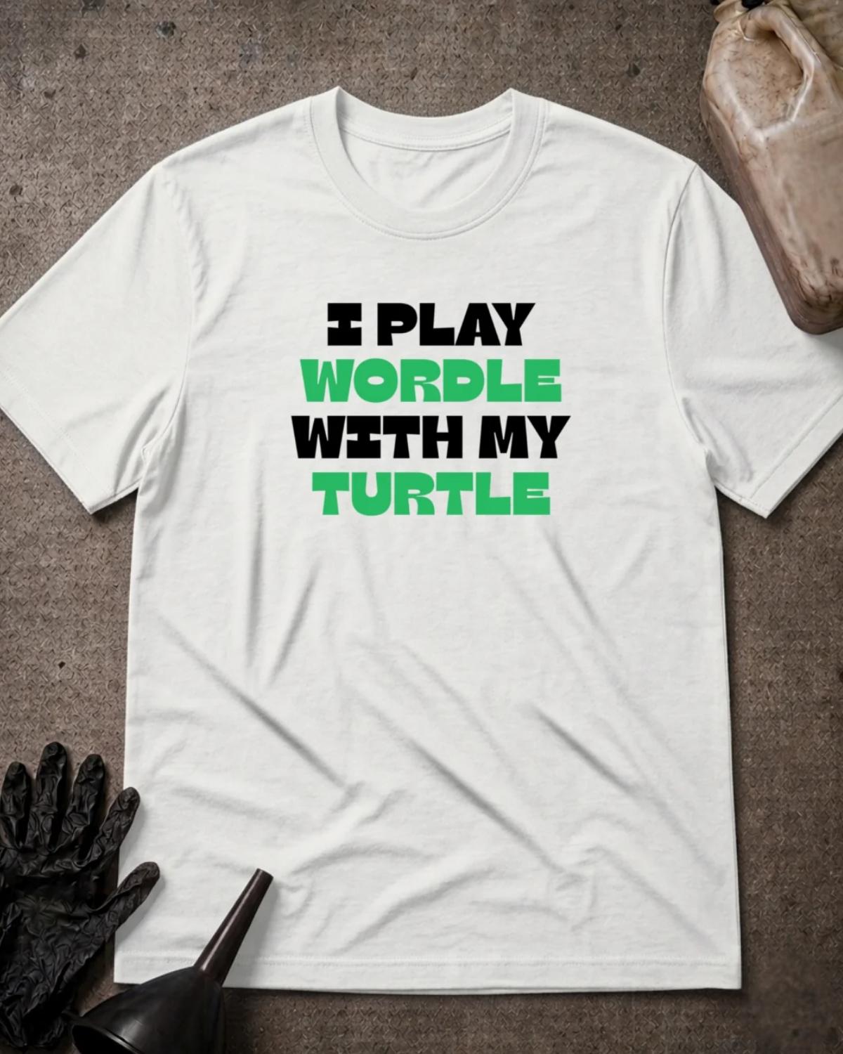 White Wordle Turtle T-shirt featuring bold black and green lettering reading “I play Wordle with my turtle.”