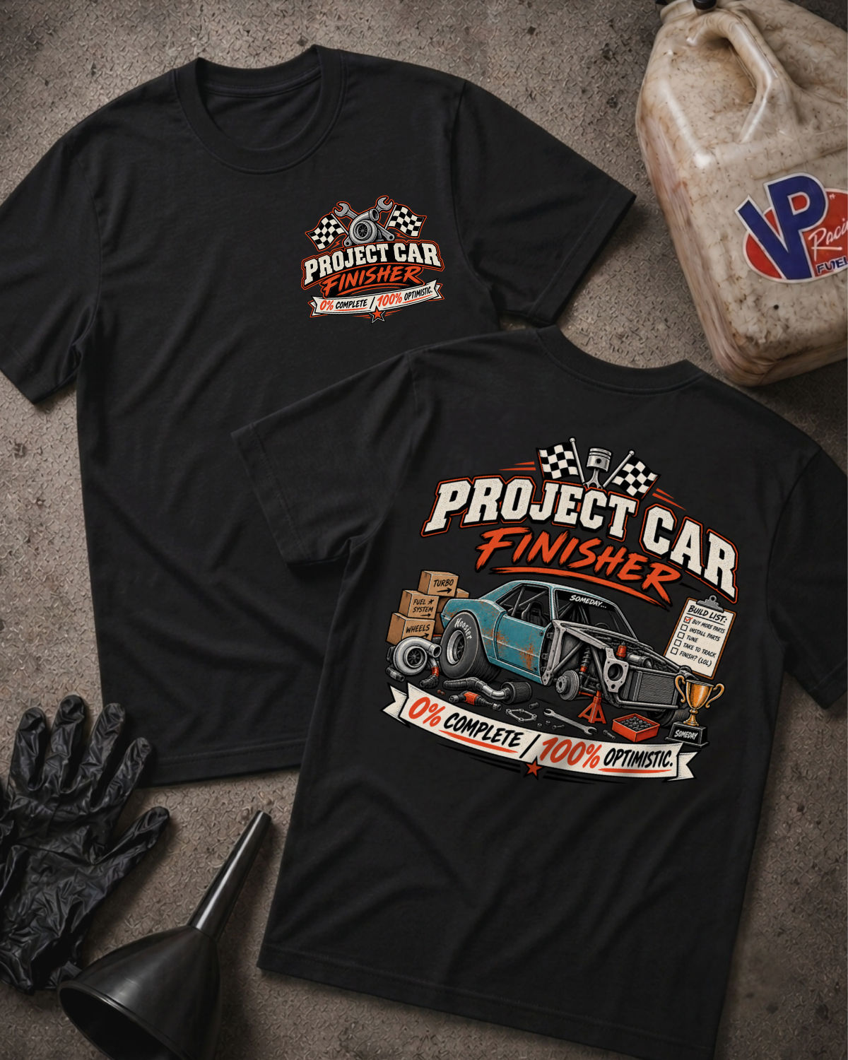 Project Car Finisher t-shirt in black showing front chest logo and full back print of a disassembled project car with text '0% Complete, 100% Optimistic'