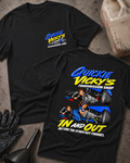 Black Quickie Vicky’s Transmission Shop T-shirt showing the front chest logo and back cartoon of a woman mechanic rebuilding a transmission under a blue hot rod, “In and Out Before the Other Guy Finishes,” with gloves, funnel, and oil jug props.