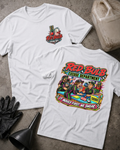 Front and back of Red Bulb Excuse Department white drag racing T-shirt with chest logo, racers arguing at an excuse desk beside a red starting light, and “It moved first. We swear.” slogan.