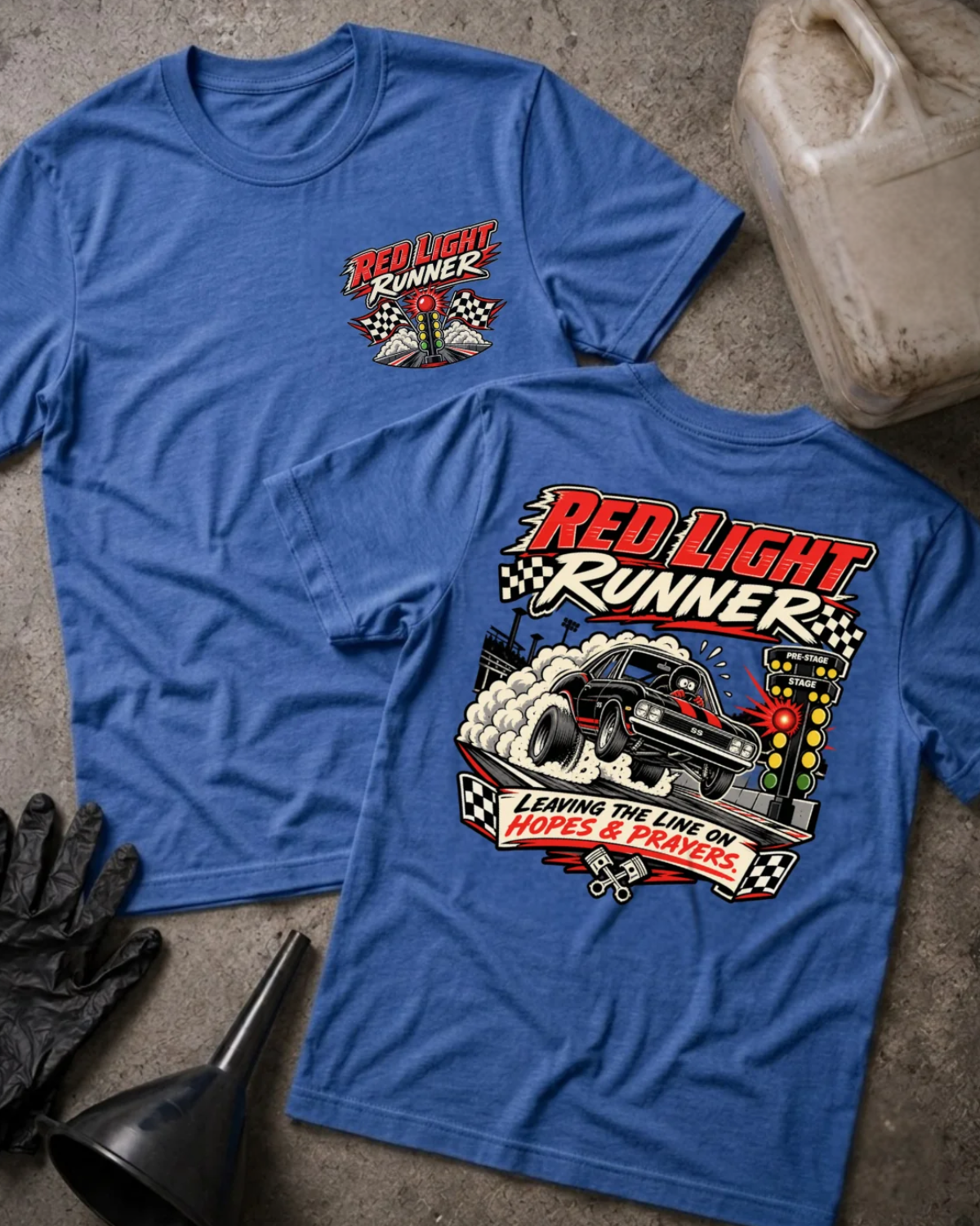 Front and back of Red Light Runner heather true royal T-shirt with chest logo, black drag car launching beside a glowing red starting light, and “Leaving the line on hopes & prayers” slogan.
