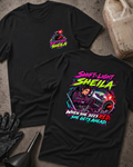 Black Shift-Light Sheila T-shirt, front and back views: small chest tachometer emblem and large neon woman driver graphic with red shift light and “When she sees red, she gets ahead.”
