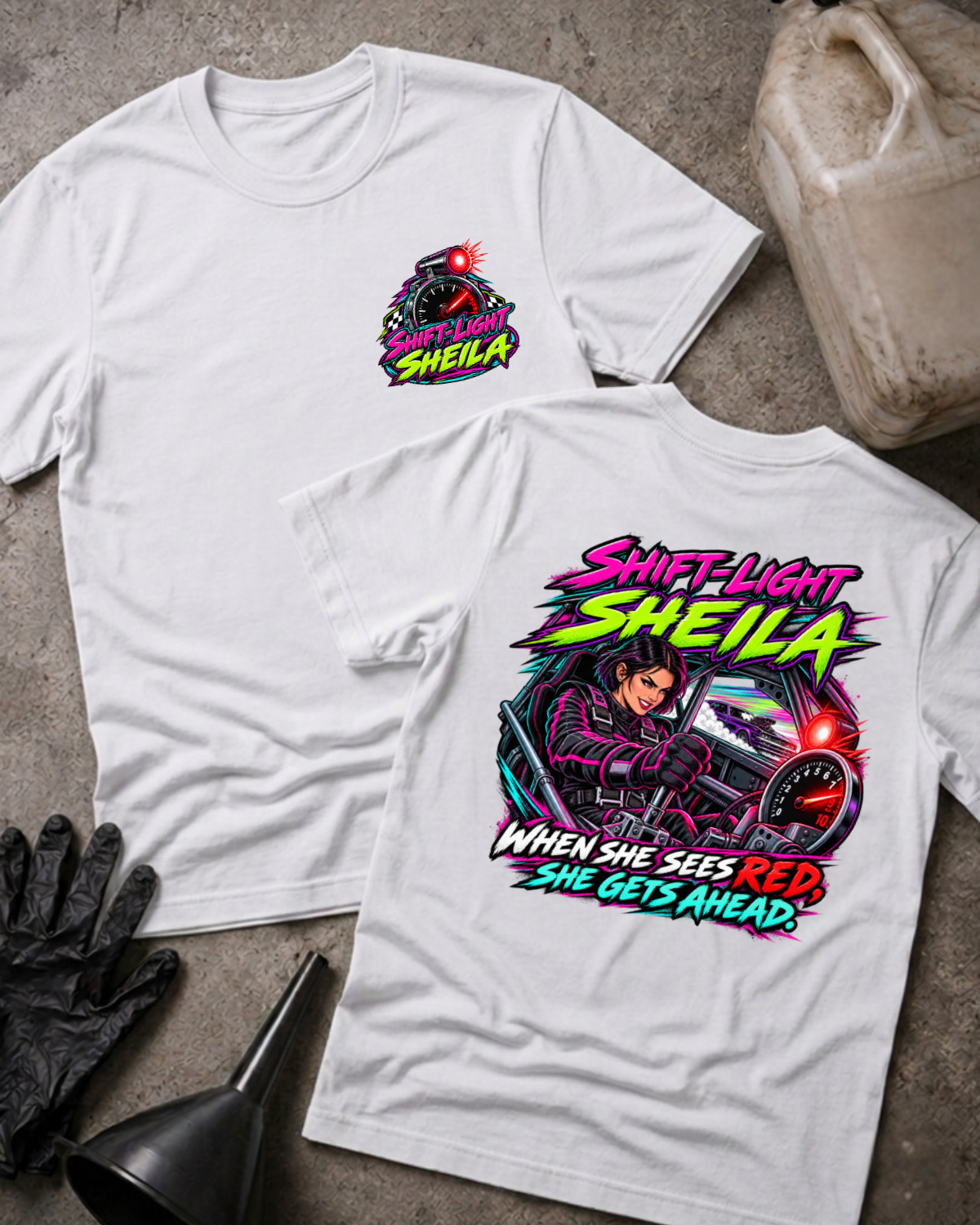 White Shift-Light Sheila T-shirt, front and back views: small chest tachometer emblem and large neon woman driver graphic with red shift light and “When she sees red, she gets ahead.”