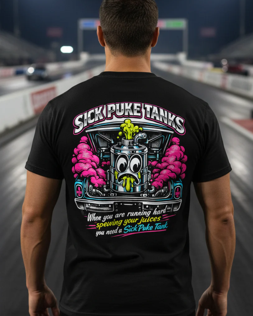 Man wearing a black Bella+Canvas 3001 t-shirt with a colorful graphic design and 'Sick Puke Tanks When you are running hard spewing your juices you need a Sick Puke Tank' text on back standing on a drag strip