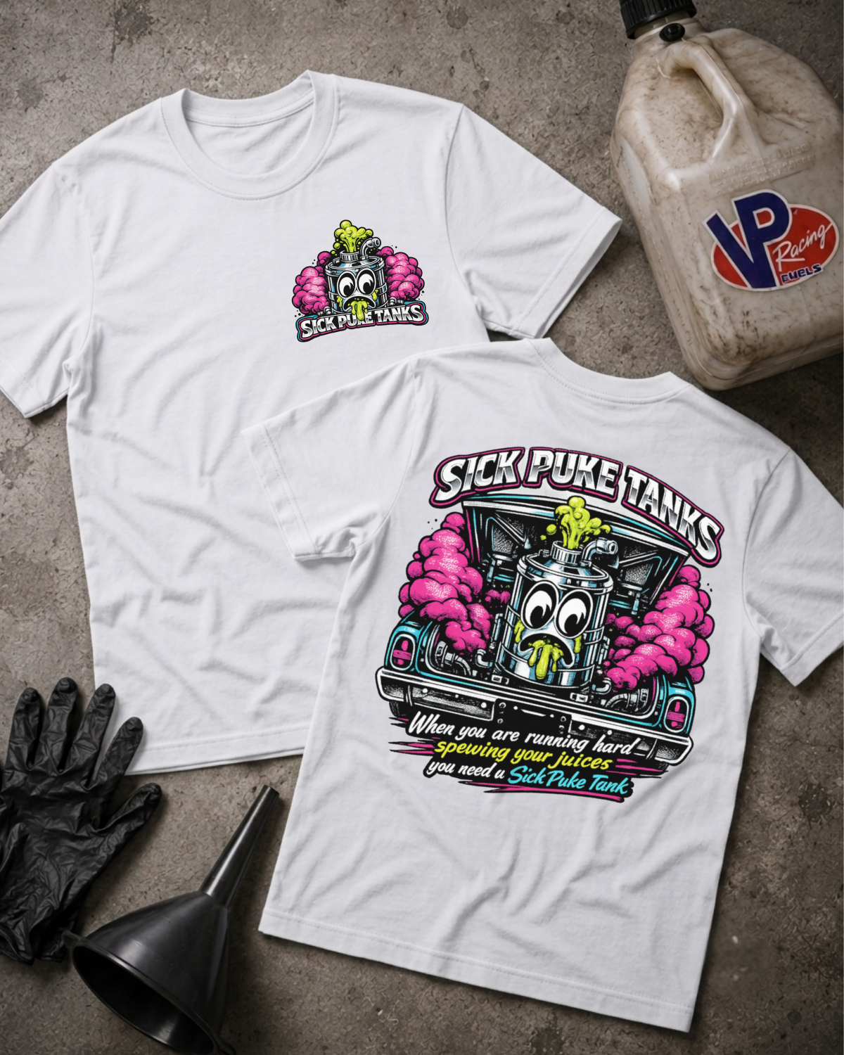 Two white graphic T-shirts laid flat on a gray concrete surface, showing the front and back designs for 'Sick Puke Tanks'. A VP Racing jug, black gloves, and a black funnel are styled as props around the shirts.