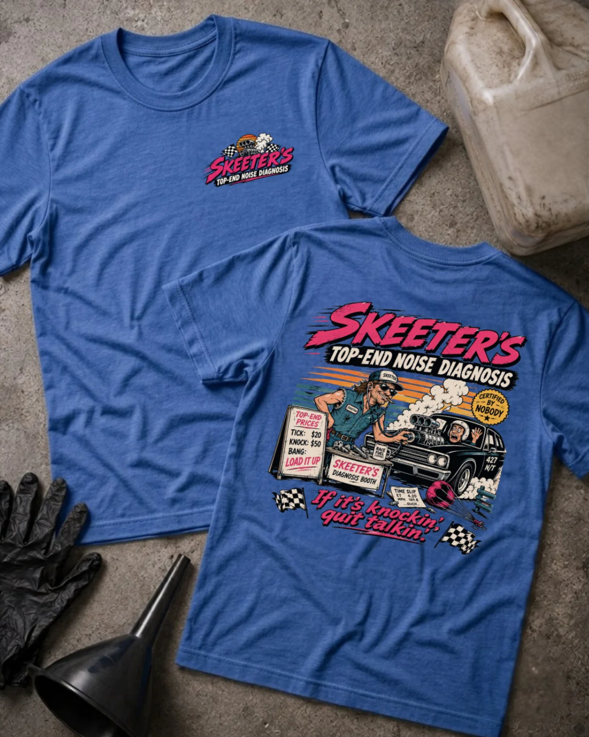 Front and back of Skeeter’s Top-End Noise Diagnosis heather true royal T-shirt with chest logo, mechanic examining a smoking muscle car engine, and “If it’s knockin’, quit talkin’” slogan.