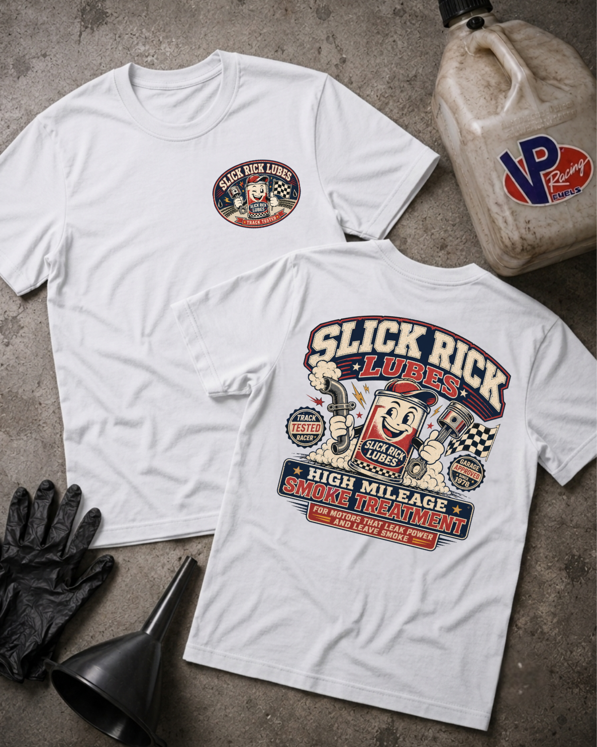 Two white Slick Rick Lubes branded t-shirts shown flat on a textured gray surface, with a black funnel, black gloves, and a VP Racing jug as styling props.