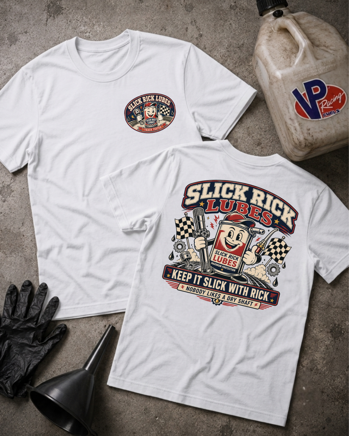 Two white graphic T-shirts laid flat on a gray concrete surface, with a black funnel, black gloves, and a VP Racing jug as props. The front shirt has a small circular chest graphic, and the back shirt has a large colorful 'Slick Rick Lubes' graphic with a cartoon character and 'Keep It Slick With Rick Nobody Likes A Dry Shaft' text.