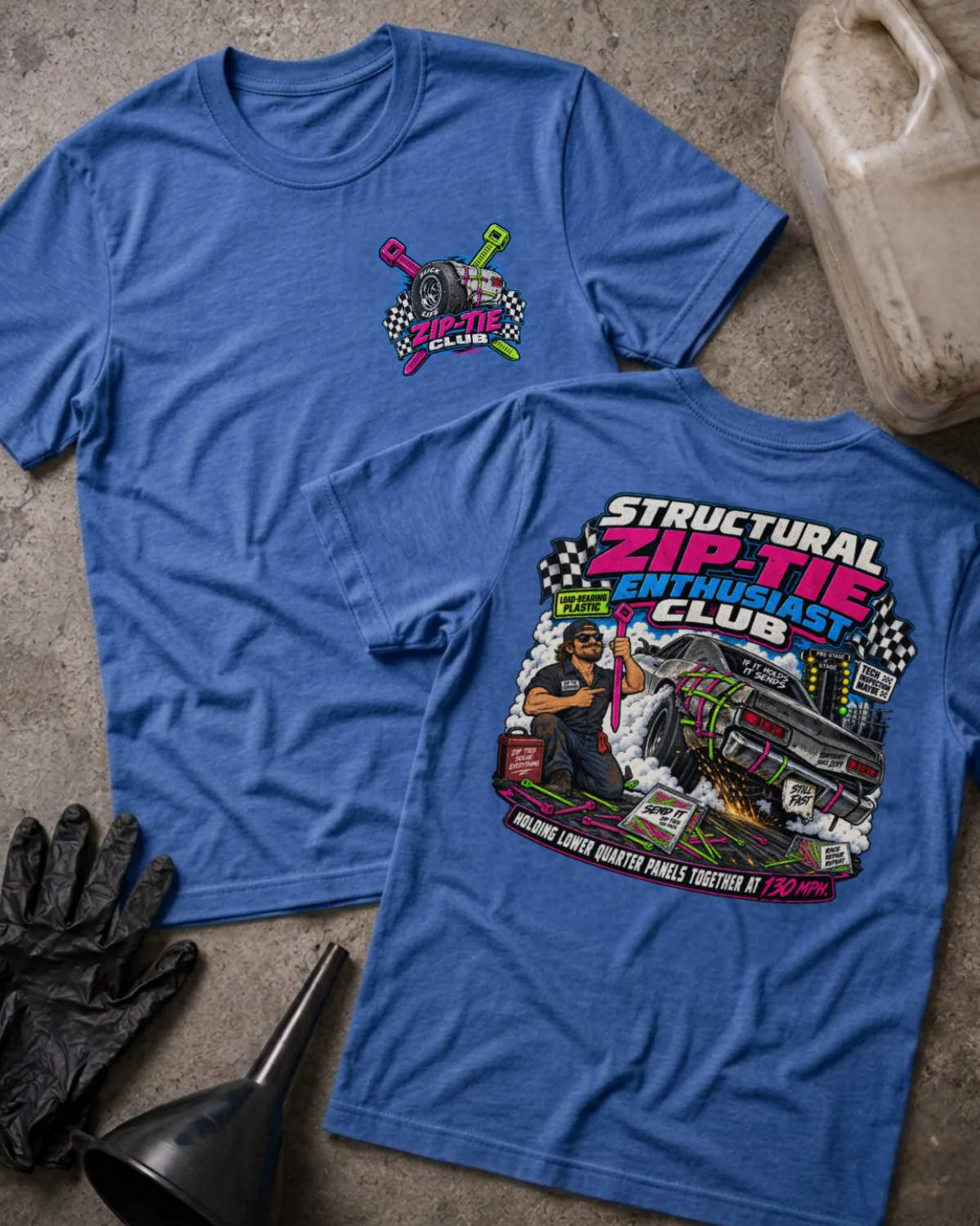 ront and back of Structural Zip-Tie Enthusiast Club heather true royal T-shirt with chest logo, mechanic holding a pink zip tie, and drag car secured with colorful zip ties.