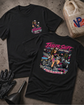 Two black graphic T-shirts laid flat on a concrete surface, showing the front and back designs. The shirts feature a colorful race-themed print with the text 'Taylor Shift Shifters' and an illustrated woman beside a race car.
