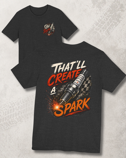 Dark grey heather t-shirt with graphic design and 'That'll create a spark' text on a textured gray background