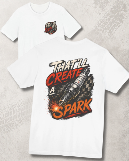 White t-shirt with graphic design and 'That'll create a spark' text on a textured surface