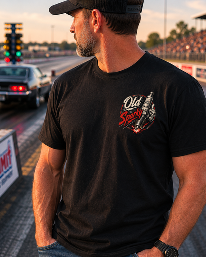 Man wearing a black t-shirt with a Old Sparky logo on a race track