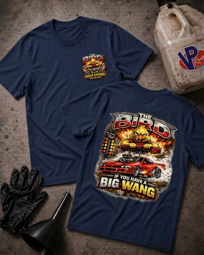 Two navy blue graphic T-shirts laid flat on a textured gray surface, with a black oil bottle, black gloves, and a black funnel around them. The front shirt shows a small multicolor chest graphic, and the back shirt shows a large graphic with the words 'THE BIRD' and 'IF YOU HAVE A BIG WANG' above and below a red sports car and a yellow bird illustration.