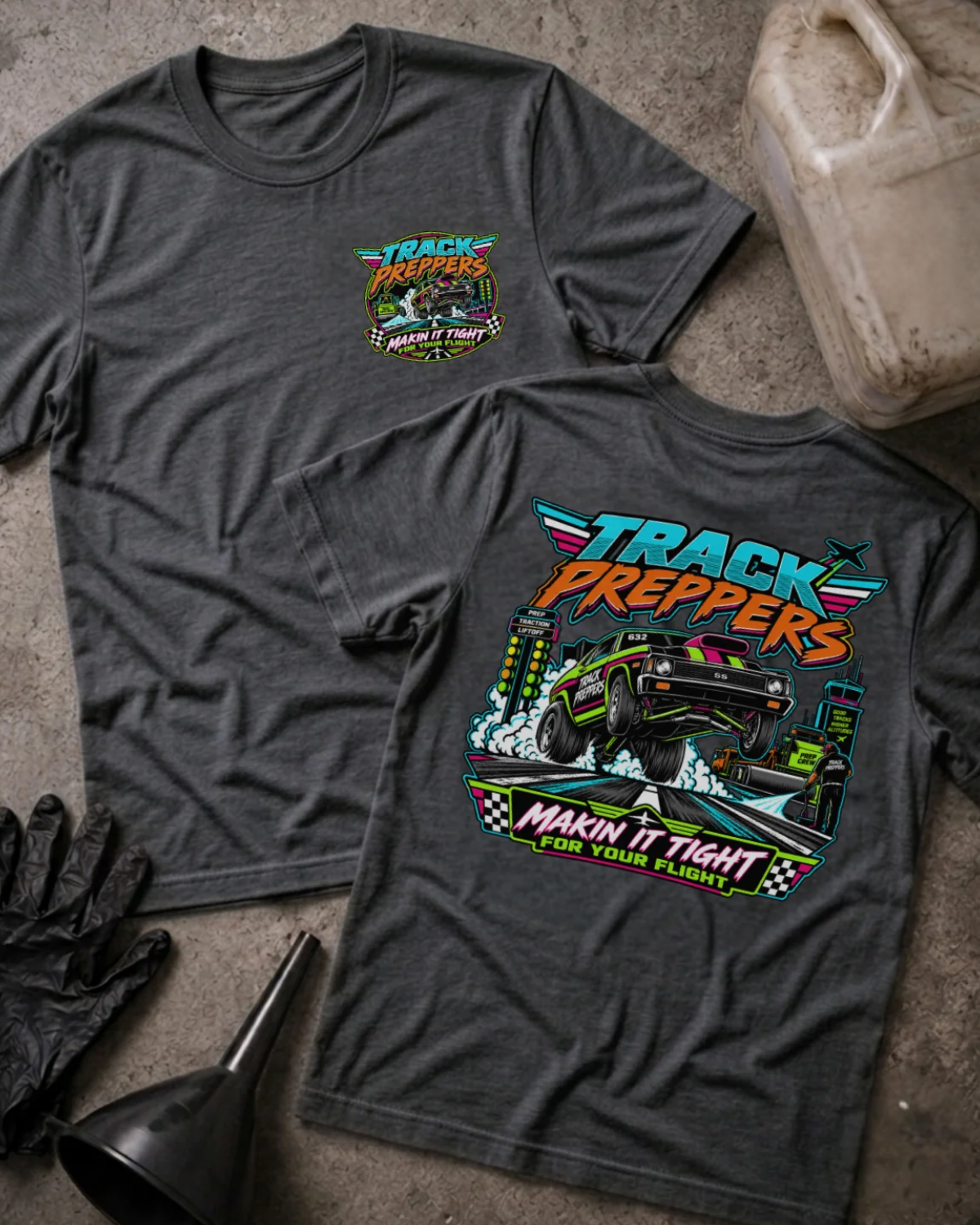 Front and back of Track Preppers dark grey heather T-shirt with chest logo, drag car lifting its front wheels beside staging lights, and “Makin’ it tight for your flight” slogan.