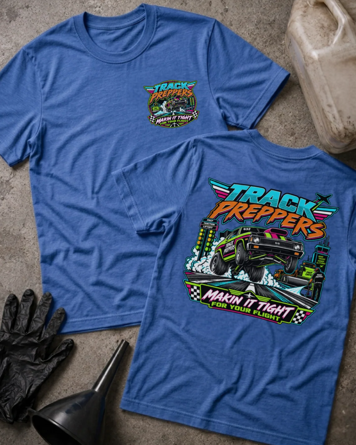 Front and back of Track Preppers heather true royal T-shirt with chest logo, drag car lifting its front wheels beside staging lights, and “Makin’ it tight for your flight” slogan.
