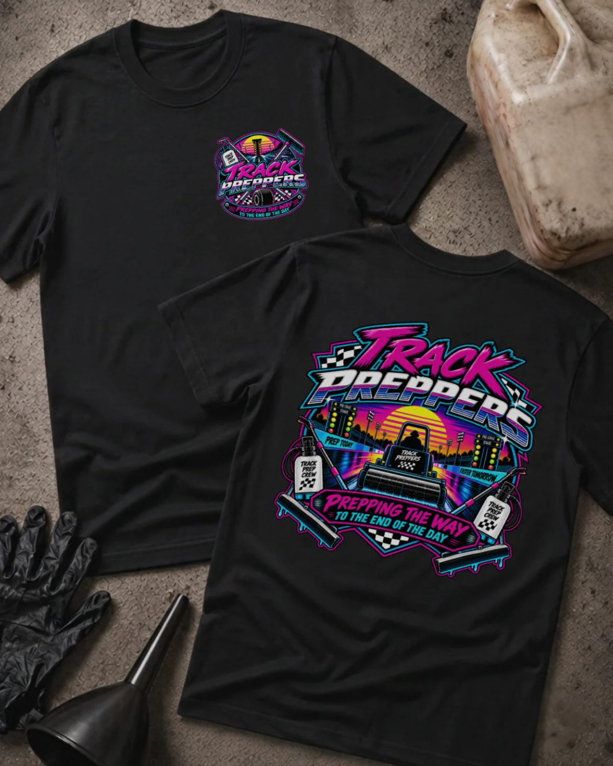 Front and back of Track Preppers black T-shirt with chest logo, track preparation equipment against a neon sunset, and “Prepping the way to the end of the day” slogan.