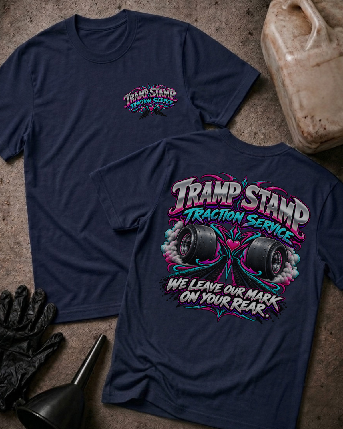 Navy Tramp Stamp Traction Service T-shirt, front and back views with a small chest logo and smoking racing slicks, pink and teal scrollwork, and “We leave our mark on your rear.”