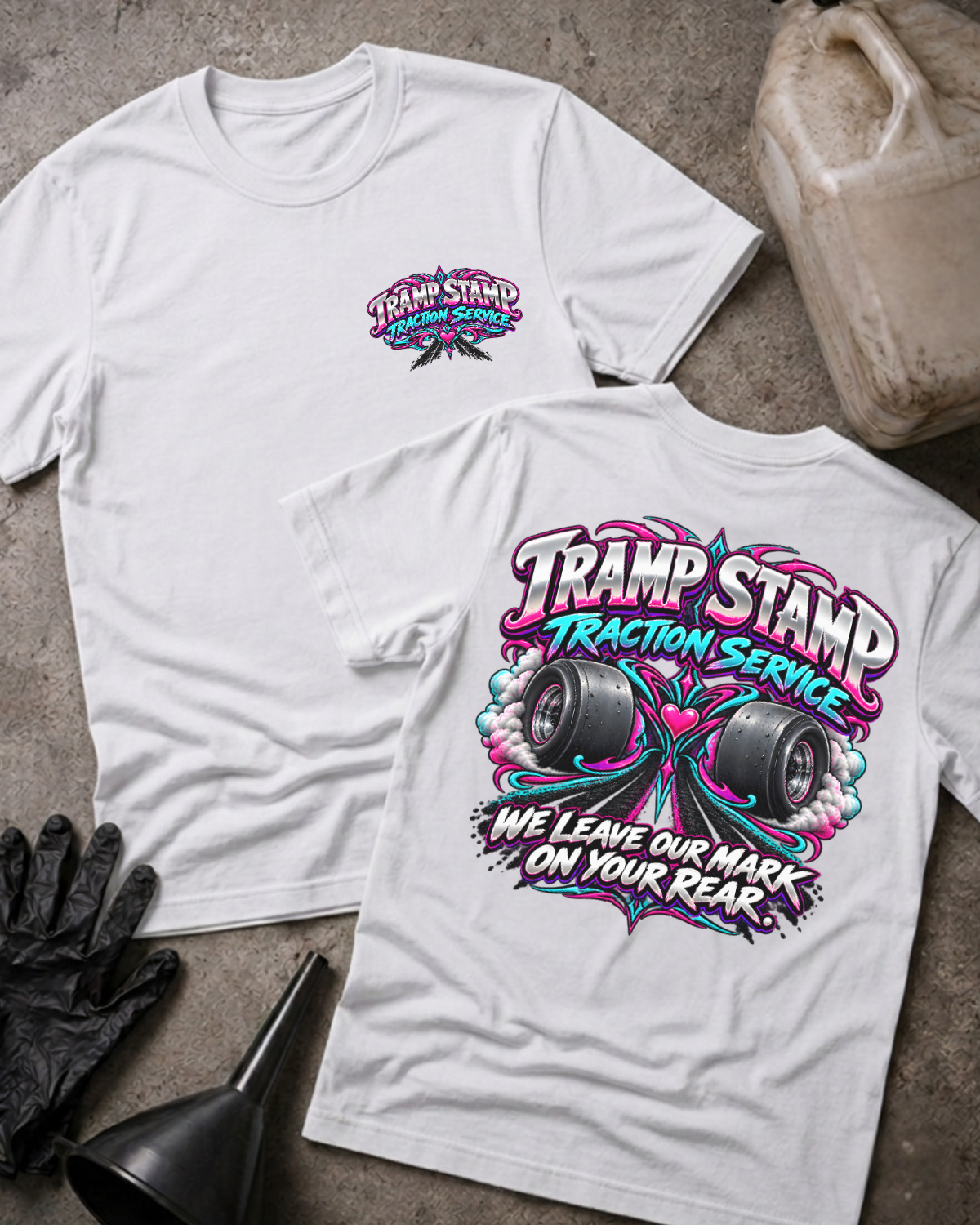 White Tramp Stamp Traction Service T-shirt, front and back views with a small chest logo and smoking racing slicks, pink and teal scrollwork, and “We leave our mark on your rear.”