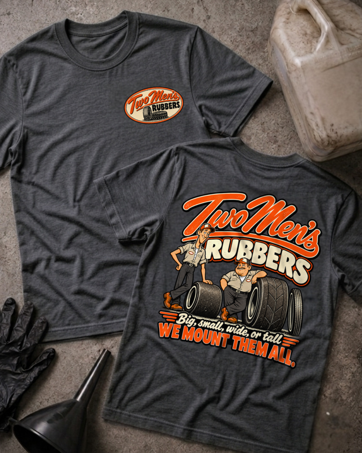 Dark Grey Heather Two Men's Rubbers T-shirt, front and back views with oval chest logo and two cartoon tire mechanics above “We mount them all.”