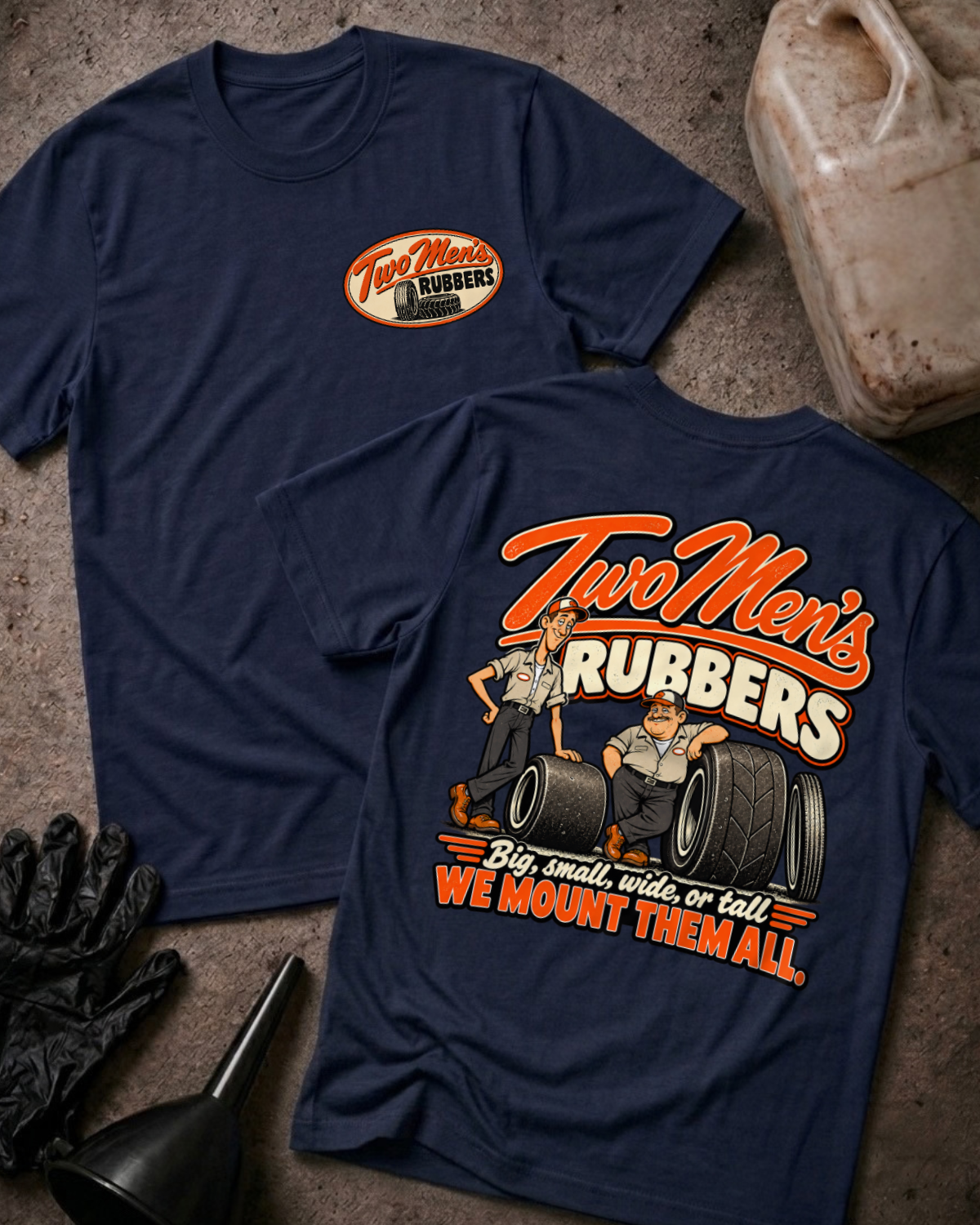 Navy Two Men's Rubbers T-shirt, front and back views with oval chest logo, cartoon mechanics leaning on tires, and “Big, small, wide, or tall We mount them all” slogan.