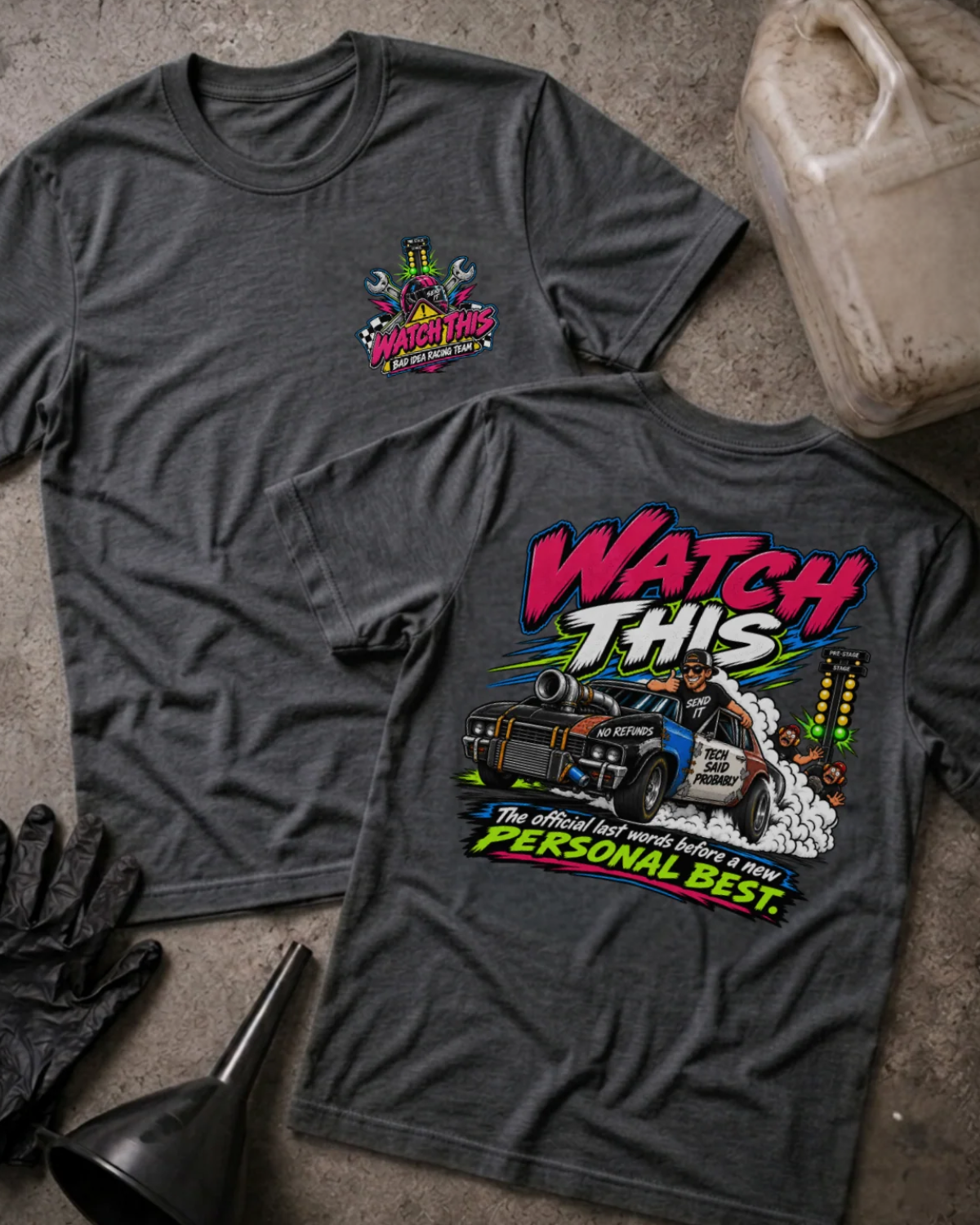 Front and back of Watch This dark grey heather T-shirt with chest logo, turbocharged drag car beside staging lights, and “The official last words before a new personal best” slogan.