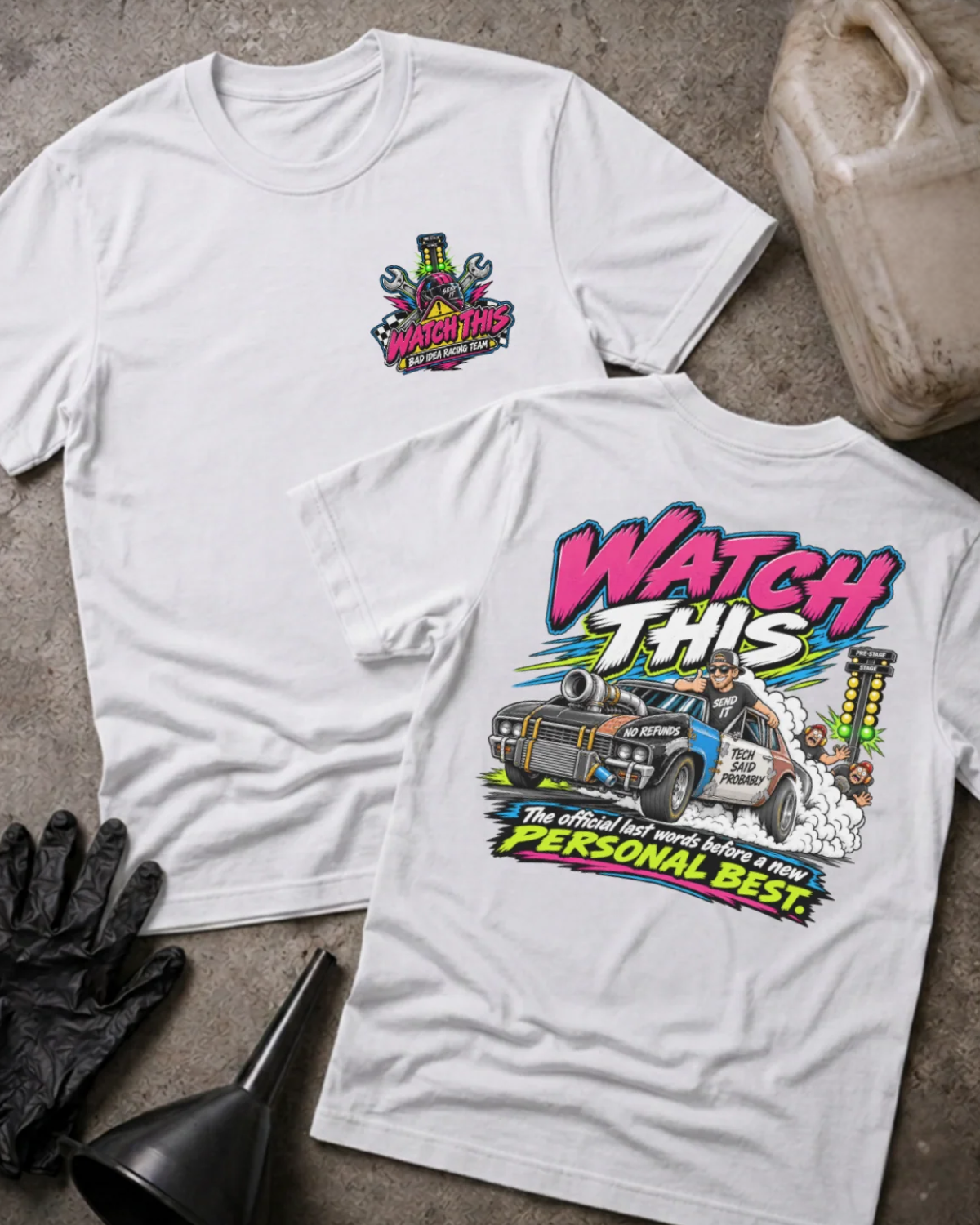 Front and back of Watch This white T-shirt with chest logo, turbocharged drag car beside staging lights, and “The official last words before a new personal best” slogan.