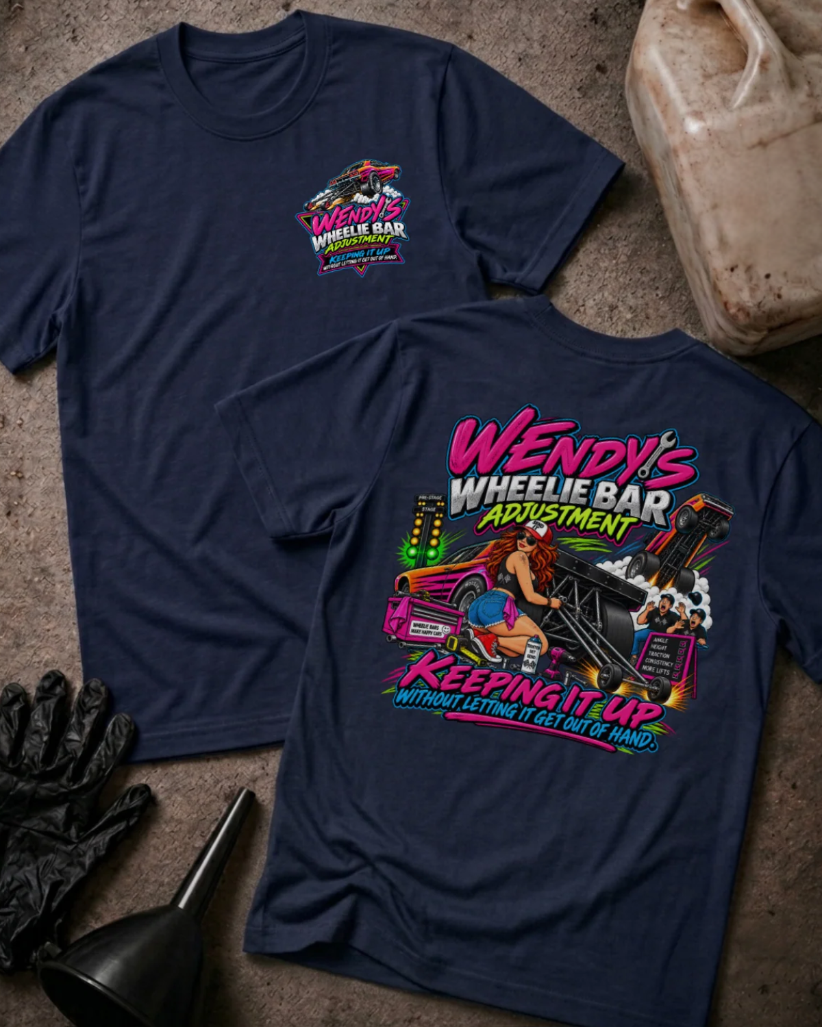 Front and back of Wendy’s Wheelie Bar Adjustment navy T-shirt with chest logo, woman adjusting wheelie bars, and “Keeping it up without letting it get out of hand” slogan.